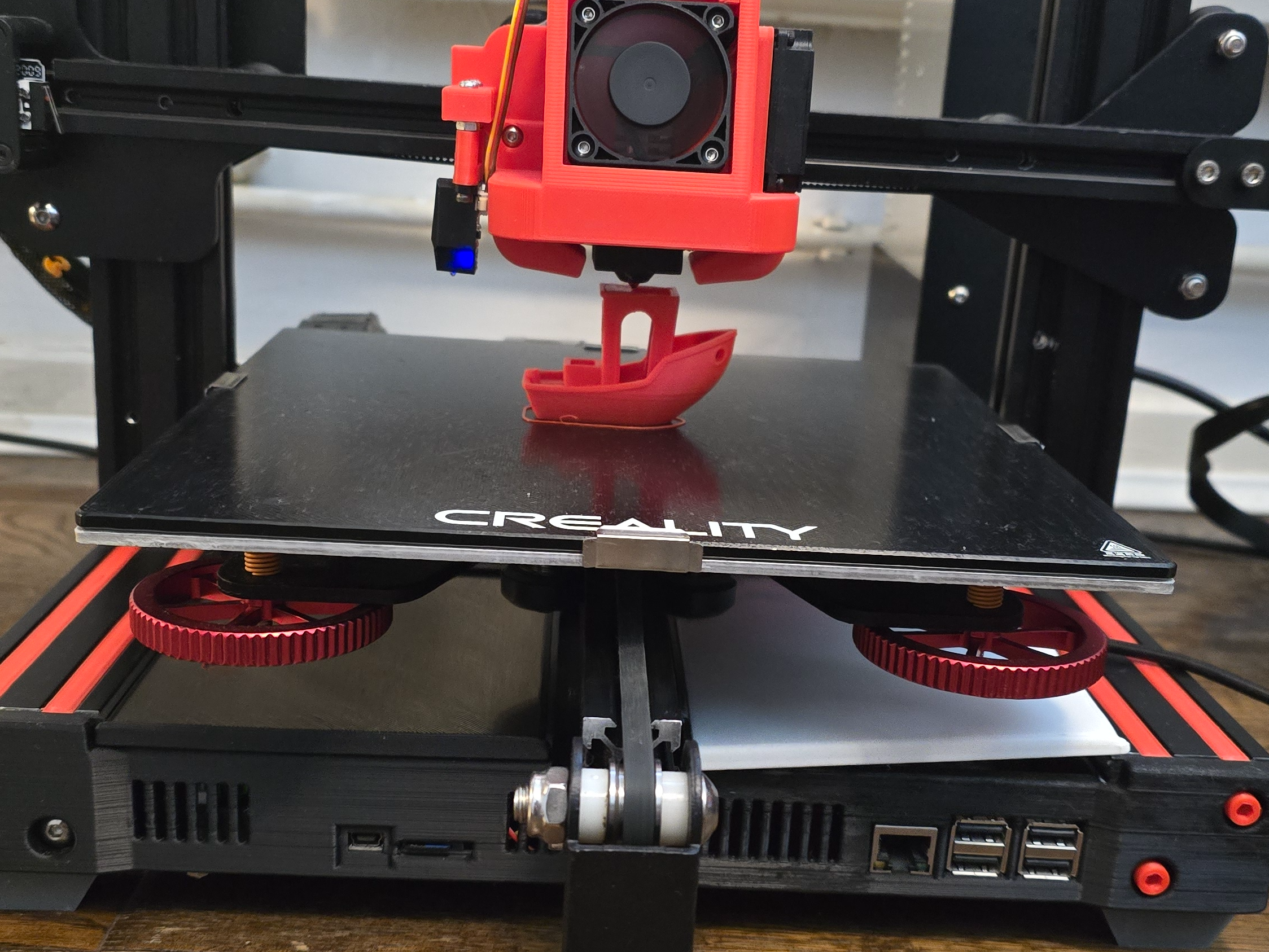 Ender 3 with new electronics enclosure installed along with enclosure for the Raspberry Pi running Klipper