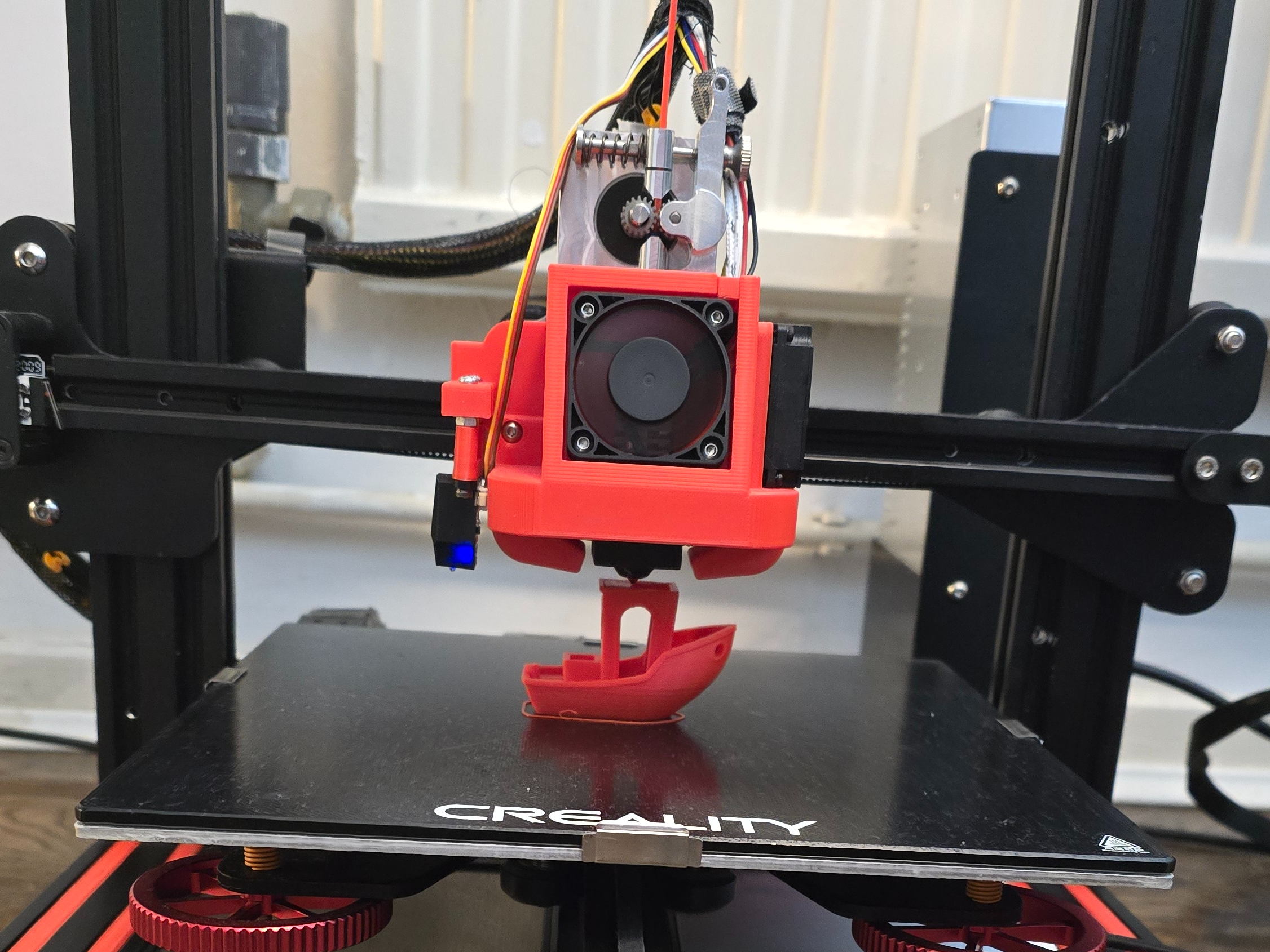 My fixed Ender 3 printing a benchy with Red PLA!